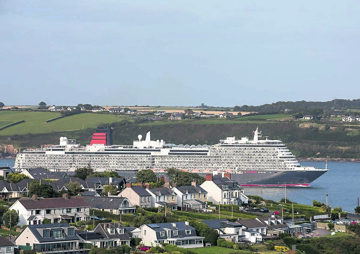 In late evening light the Cunard cruise ship, Queen Anne, passes the seafront homes at Churchbay, Crosshaven, as she departs Cork Harbour for a voyage bound to Reykjavík, Iceland.	Picture: David Creedon
                