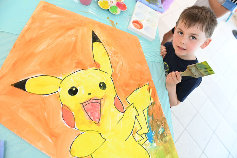  Ronan Jermy busy painting his kite featuring Pikachu at the Kite Festival HQ at Douglas Court Shopping Centre.
