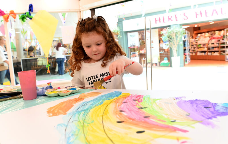  Abbie busy decorating her kite at the Kite Festival HQ at Douglas Court Shopping Centre.