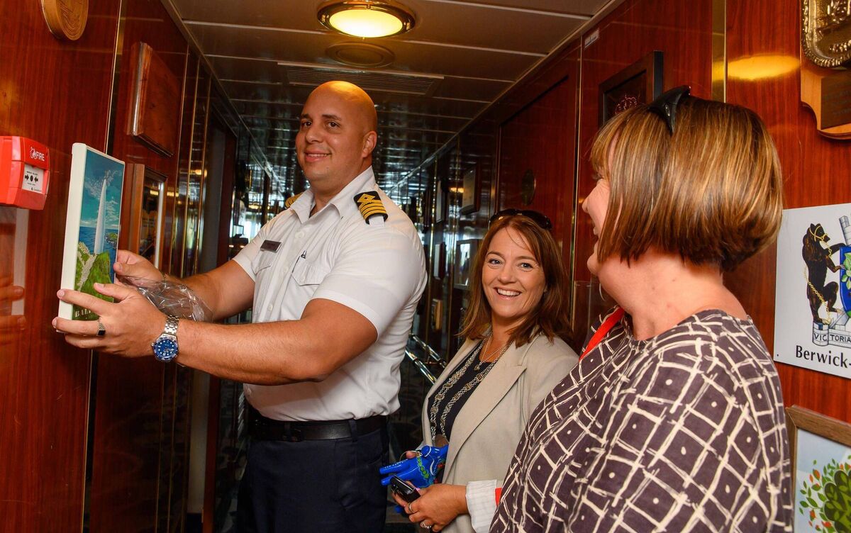 Cllr Caroline Cronin making a presentation to Jose Fonseca, captain of the cruise liner, with Noreen O’Mahony of Cork County Council. Picture: John Allen.