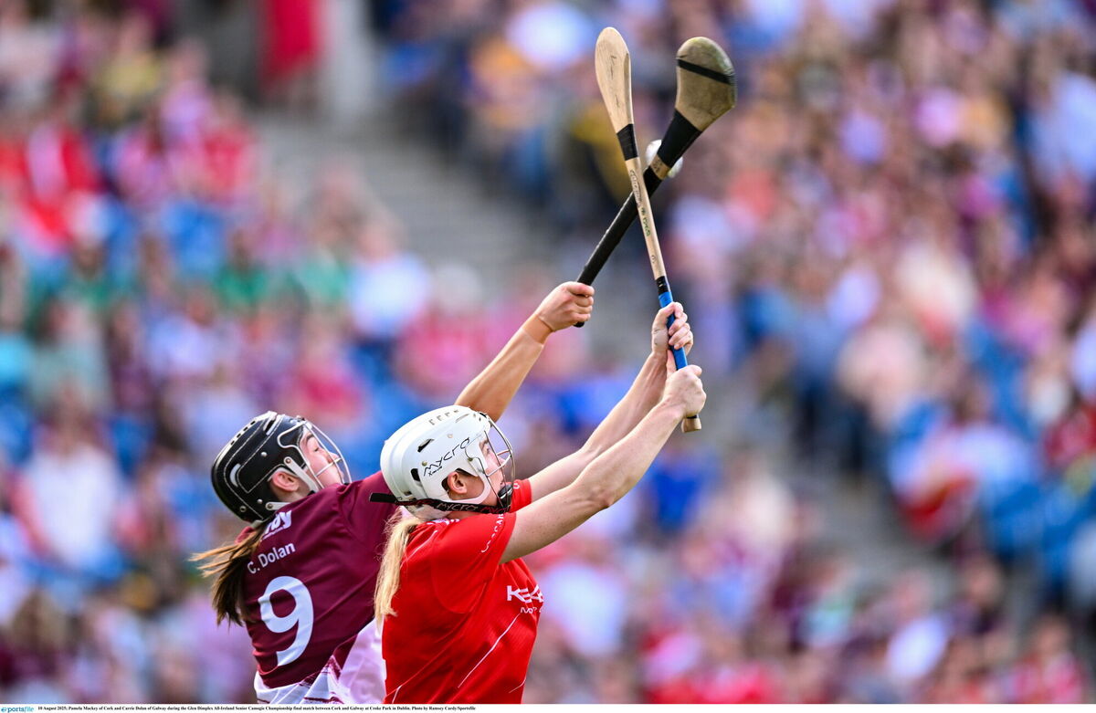 Pamela Mackey of Cork and Carrie Dolan of Galway contest a dropping ball. Picture: Ramsey Cardy/Sportsfile