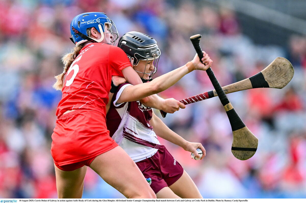 Carrie Dolan of Galway feels the pressure from Aoife Healy of Cork. Picture: Ramsey Cardy/Sportsfile