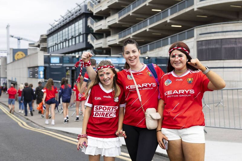Cork fans Katie Rose (11), mum Barbra Doyle and Lottie Terry (14) outside Croke Park ahead of the All Ireland Camogie Snr Final with Galway vs Cork. Photo: Sam Boal/Collins photos