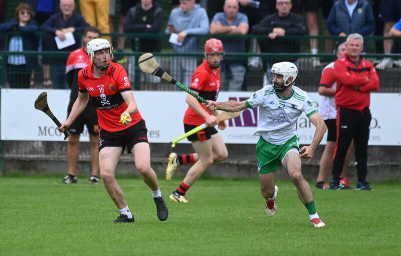  Daniel Twomey in action for UCC as Mukserry's William Aherne attempts a block. Picture: Larry Cummins