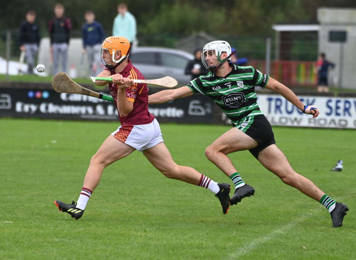 Youghal's Oisin Hill shoots from Douglas' David Kelly during the Co-Op Superstores Cork IAHC relegation playoff at Carrigtwohill in 2023.  Picture: Eddie O'Hare