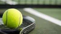 Tennis Ball and Racket on the Court Horizontal