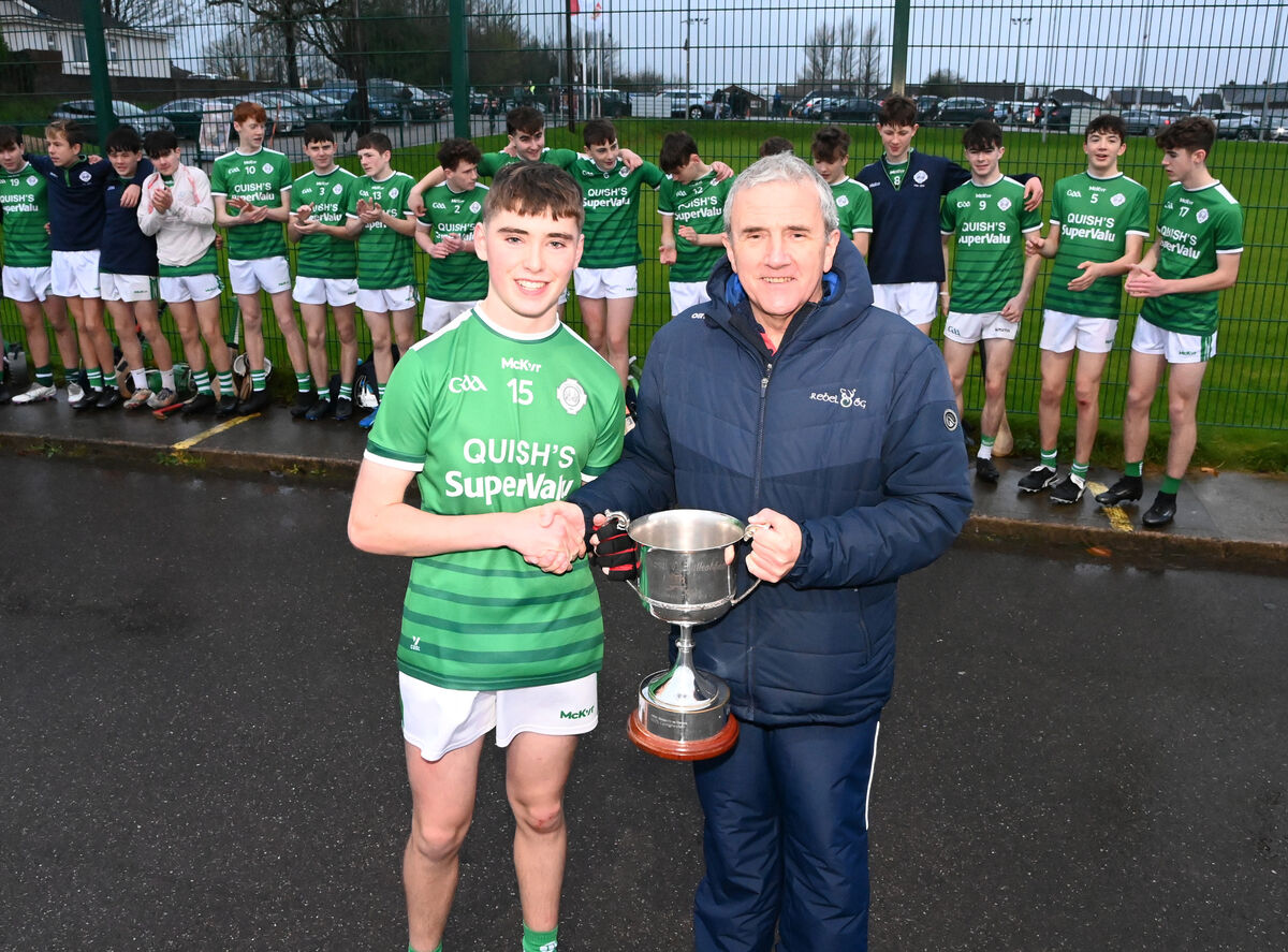 Michael O'Mahony, chairman Rebel Óg presents the trophy to Ballincollig captain Cal McCarthy after defeating Sarsfields in the Rebel Óg under 15 Premier 1 HC final at Bishopstown last season. Picture: Eddie O'Hare