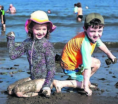Róisín and Fionn Gubbins from Carrigaline enjoying the evening sun at Fountainstown beach.	Picture: Chani Anderson
                    