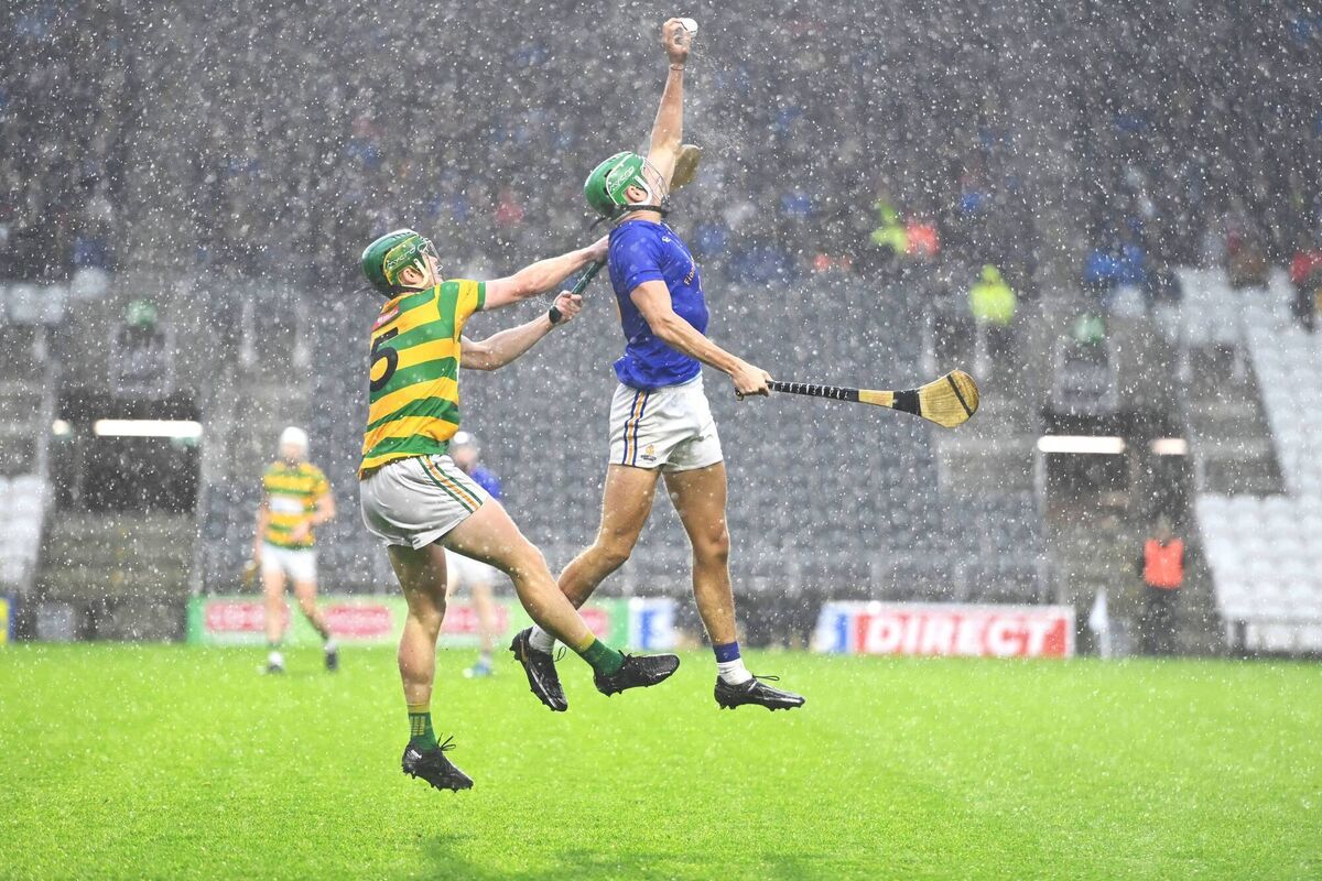 Ben Cunningham winning the sliotar from Cathal Cormack, Blackrock, in driving rain at Páirc Uí Chaoimh in 2022. Picture: Larry Cummins