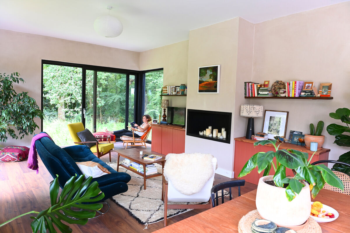 Deirdre relaxes in the living room, overlooking the wild meadow garden. Pictures: Larry Cummins Deirdre relaxes in the living room, overlooking the wild meadow garden. Pictures: Larry Cummins