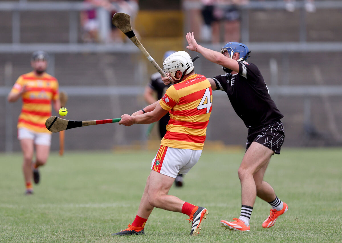  Patrick White, Midleton, tries to block James Kelleher, Newcestown. Picture: Jim Coughlan.