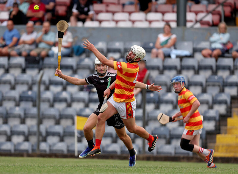  David Cremin, Midleton, battles with James Kelleher, Newcestown. Picture: Jim Coughlan.