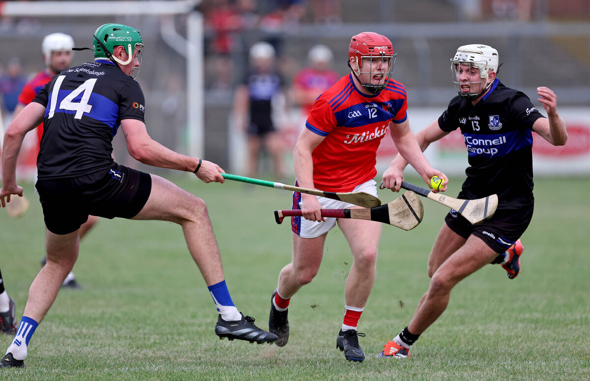 James Sweeney and Ben Nodwell, Sarsfields battle Peter O'Shea, Erins Own. Picture: Jim Coughlan. James Sweeney and Ben Nodwell, Sarsfields battle Peter O'Shea, Erins Own. Picture: Jim Coughlan.
