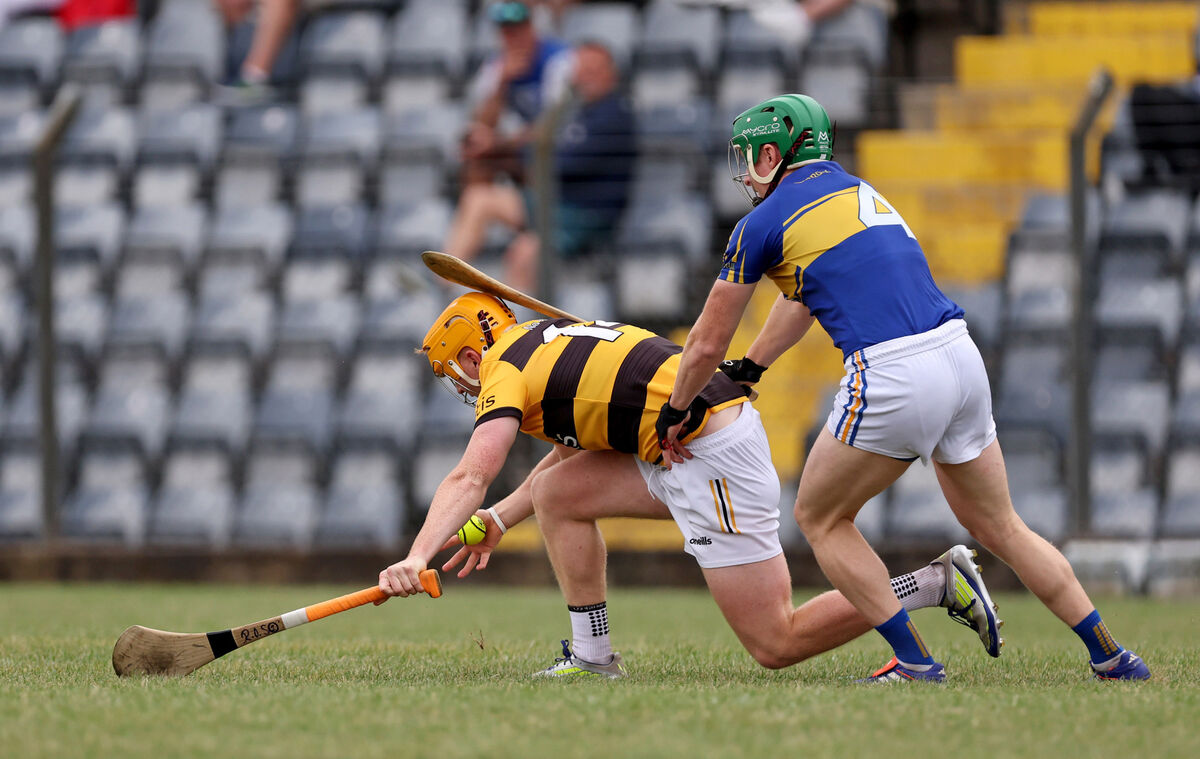 Ross O'Sullivan of Na Piarsaigh under pressure from Pat O'Sullivan of Carrigtwohill. Picture: Jim Coughlan Ross O'Sullivan of Na Piarsaigh under pressure from Pat O'Sullivan of Carrigtwohill. Picture: Jim Coughlan