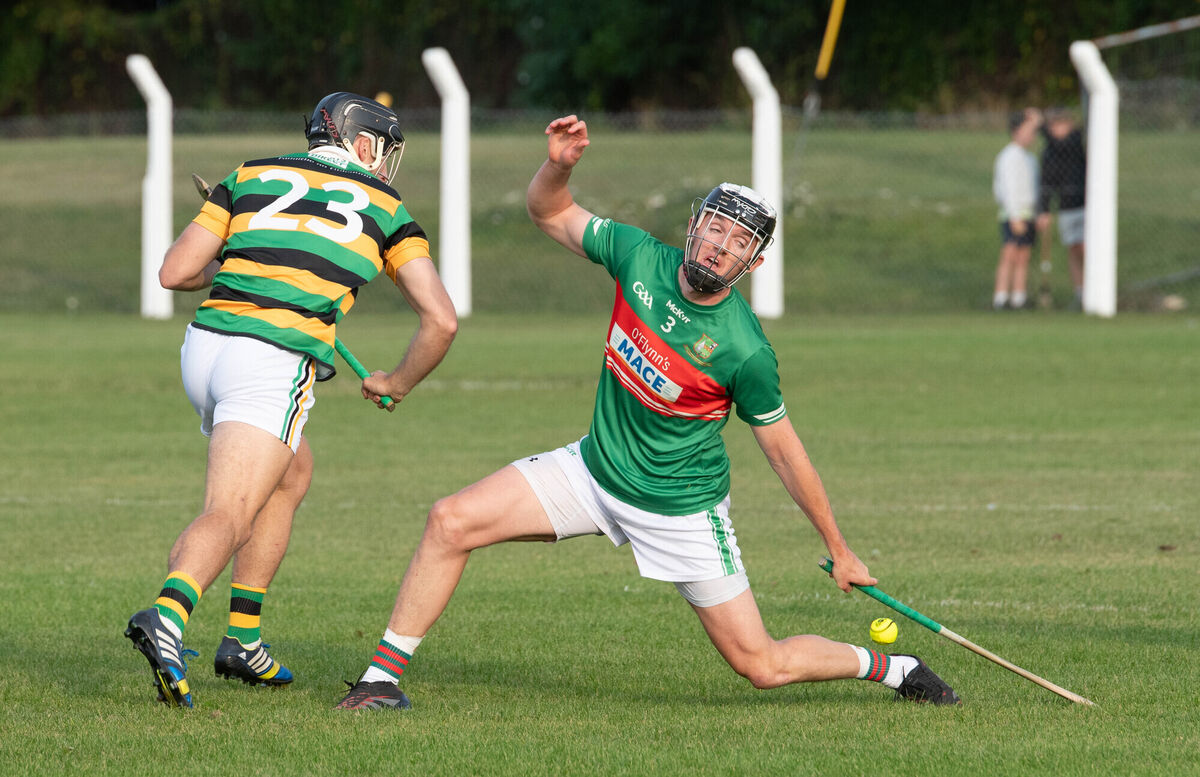 Glen Rovers' Simon Kennefick has his shot blocked by Ger Millerick of Fr O'Neill's. Picture: Howard Crowdy