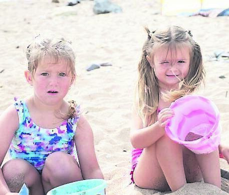Bonnie Mulcahy, of Ballyphehane, and Kayla O’Connor, from Mayfield, on Claycastle Beach in Youghal.	Picture: Howard Crowdy
                    