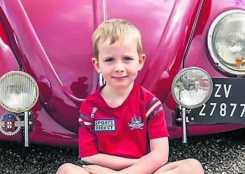 Enniskeane, West Cork, Ireland. 10th Aug, 2025. A charity vintage car, truck and tractor show was held in Enniskeane today, in aid of Maeve O'Mahony and the Ballineen &amp; Enniskeane Christmas Lights Group. Cars, tractors, trucks and motorbikes were on display, which drew a fair sized crowd. Evan Connolly-Duffy from Bishopstown with a vintage VW Beetle. Picture: Andy Gibson.