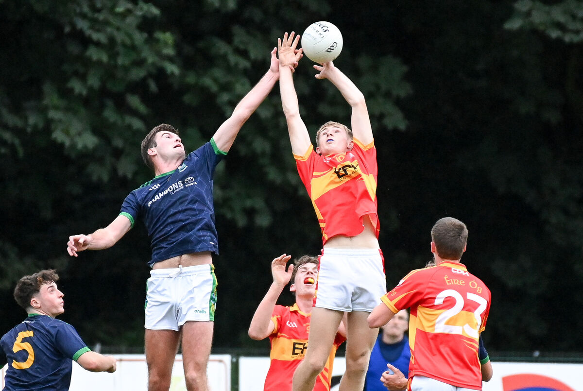 Glanmire's Rory Higgins and Éire Óg's Ethan Hyde compete in the air. Picture: David Keane. Glanmire's Rory Higgins and Éire Óg's Ethan Hyde compete in the air. Picture: David Keane.