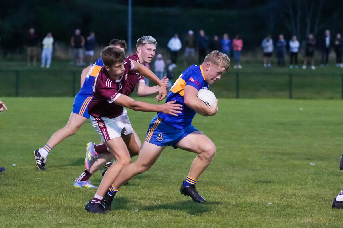 Carrigaline's Diarmuíd Ó Beoláin feeling the pressure from Sé Clarke and Andy Cuthbert of Bishopstown. Picture: Noel Sweeney Carrigaline's Diarmuíd Ó Beoláin feeling the pressure from Sé Clarke and Andy Cuthbert of Bishopstown. Picture: Noel Sweeney