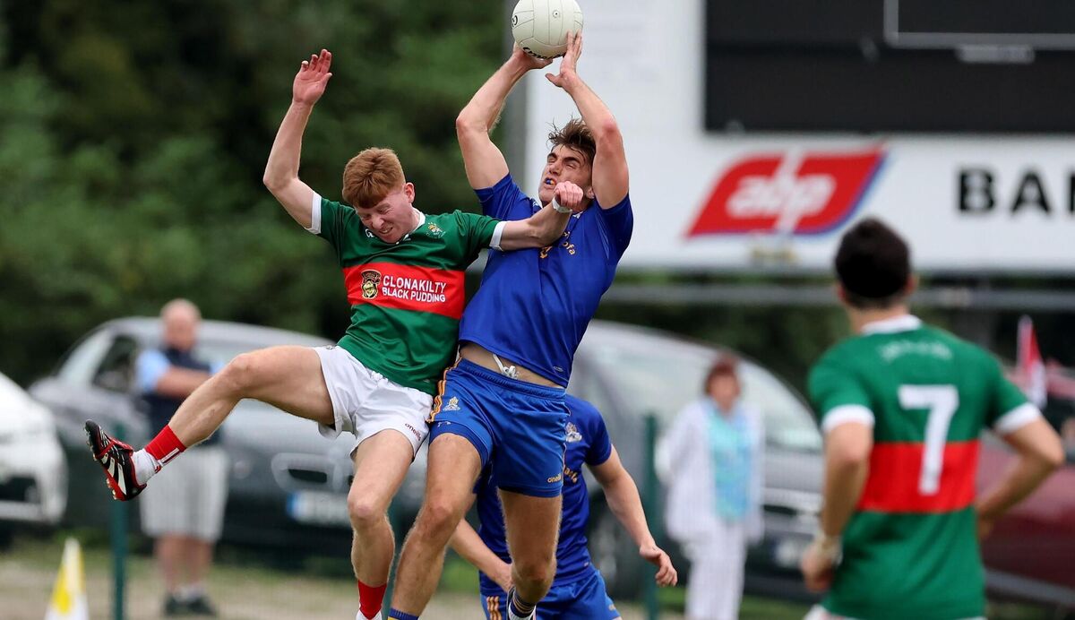 Ian Maguire, St. Finbarrs, and Ross Mannix, Clonakilty, contest the high ball during the McCarthy Insurance Group Premier Senior Football Championship at Bandon. Picture: Jim Coughlan.
