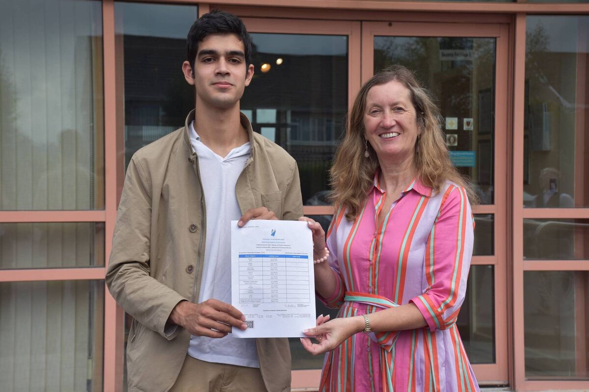 Kieran Sisk Ravindran, Coláiste an Spioraid Naoimh student who got 9 H1s, with the retiring/outgoing Principal, Ms. Brenda Moriarty.