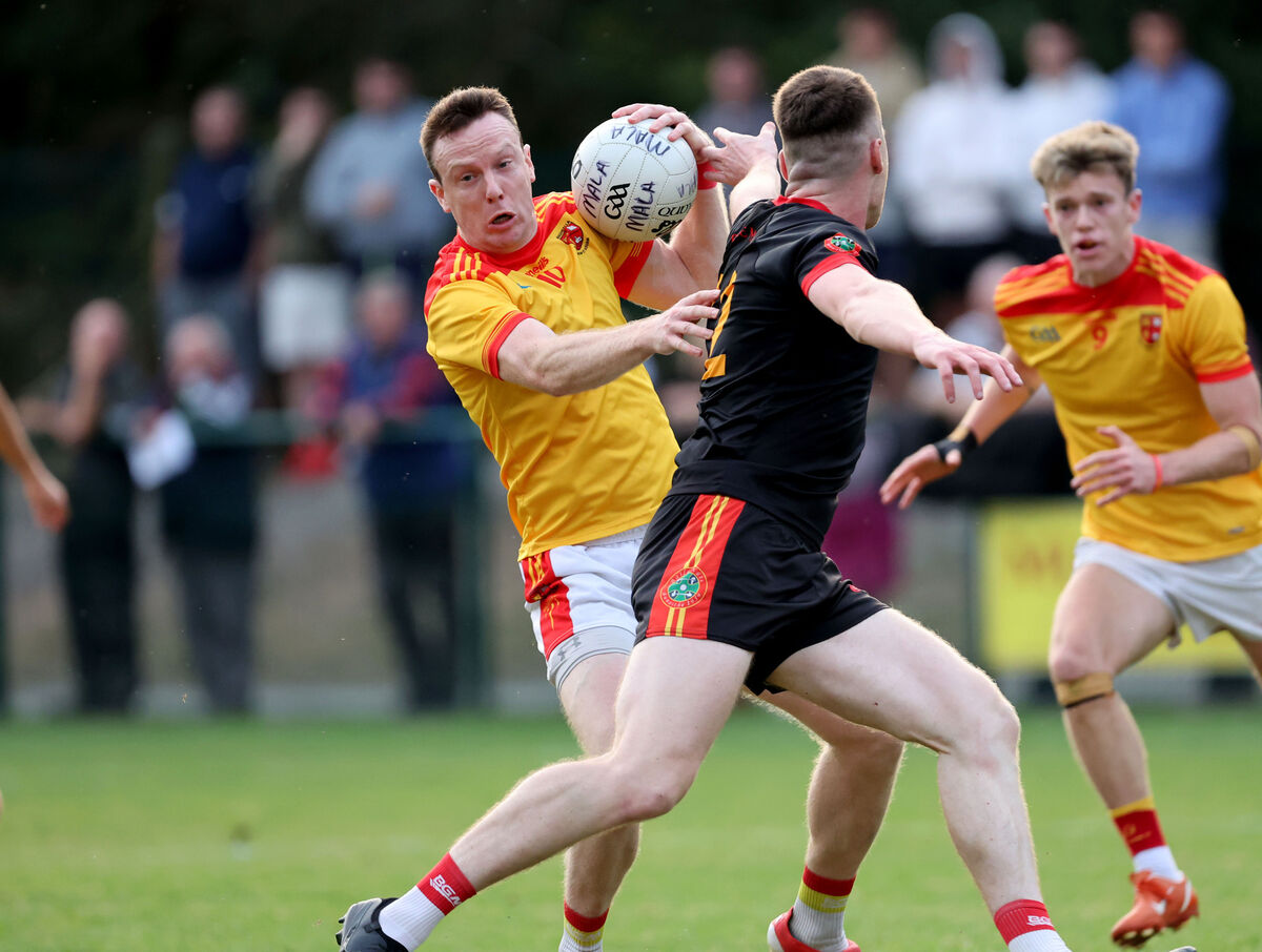 Michael O'Rourke of Mallow holds possession under pressure from Newcestown's David Buckley. Picture: Jim Coughlan Michael O'Rourke of Mallow holds possession under pressure from Newcestown's David Buckley. Picture: Jim Coughlan