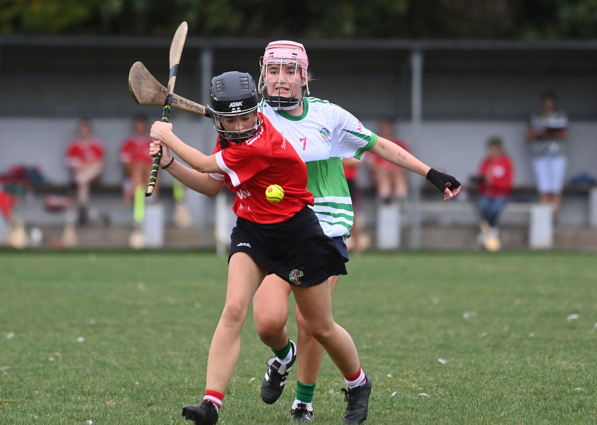 Elannah Sheehan, Seandún, with possession as Sophie Donohoe, Muskerry, attempts a hook. Picture: Larry Cummins Elannah Sheehan, Seandún, with possession as Sophie Donohoe, Muskerry, attempts a hook. Picture: Larry Cummins