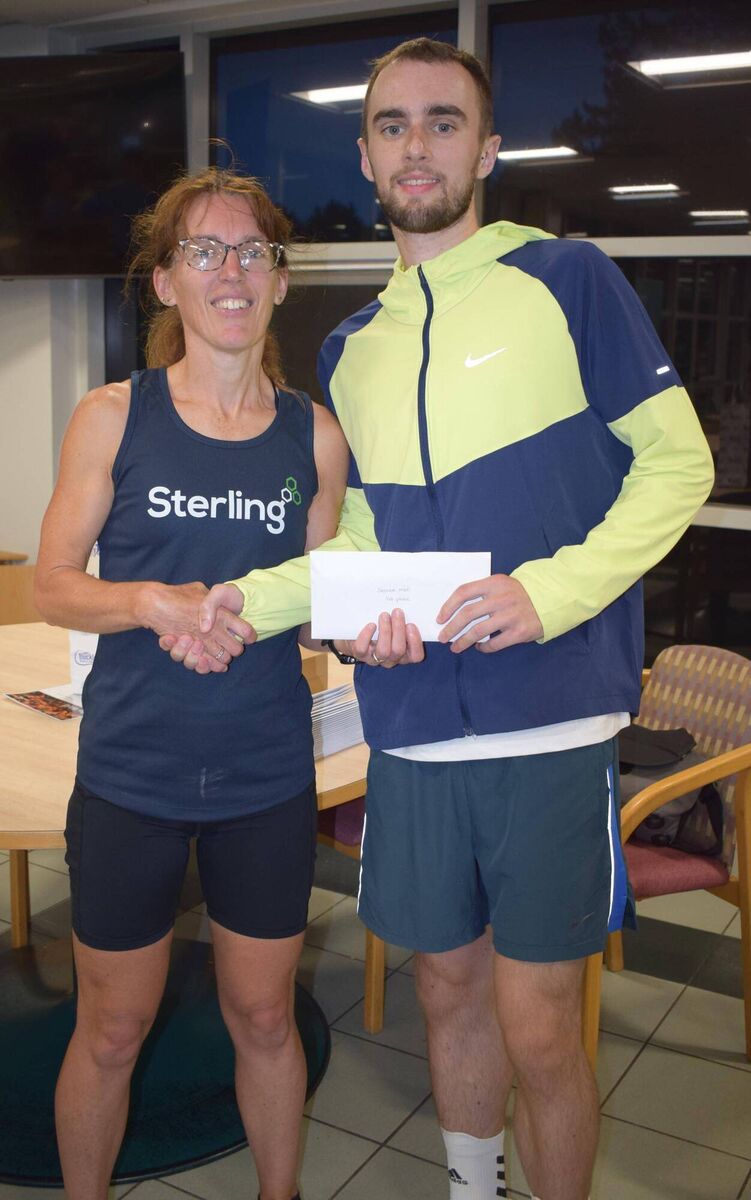 Ruairi Casey, first in the Sterling 5km, receiving his prize from Siobhan Holland. Picture: John Walshe Ruairi Casey, first in the Sterling 5km, receiving his prize from Siobhan Holland. Picture: John Walshe