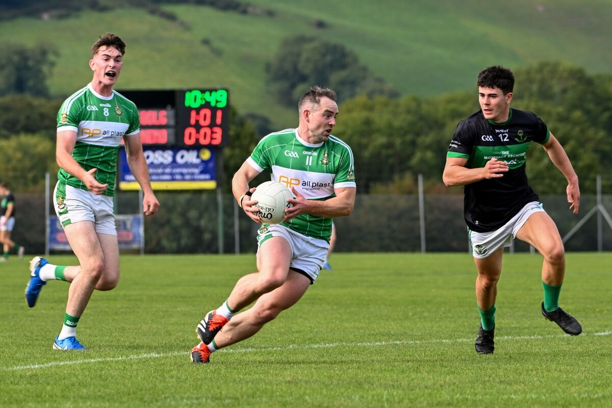 Aghabullogue captain John Corkery breaks forward from Nemo Rangers' Oisín White. Picture: Chani Anderson Aghabullogue captain John Corkery breaks forward from Nemo Rangers' Oisín White. Picture: Chani Anderson