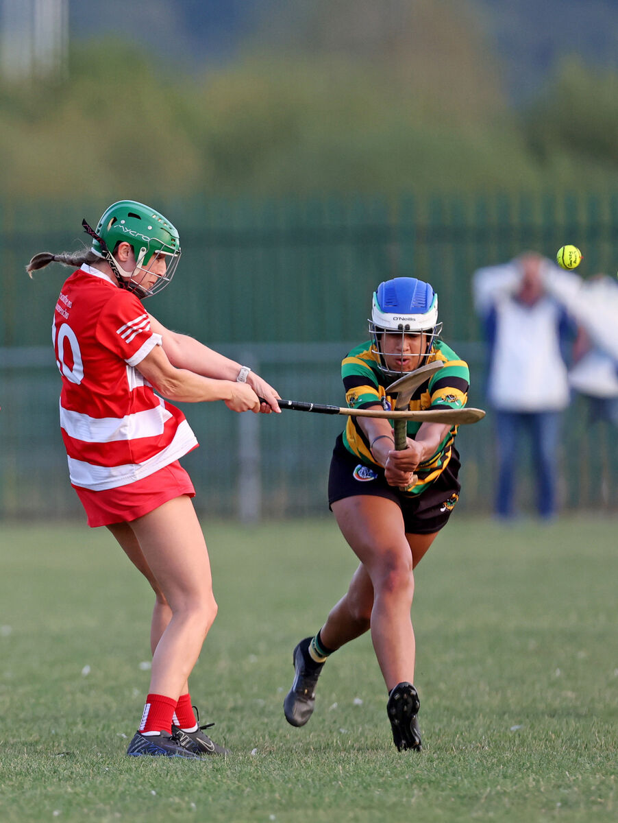  Edel Moloney, Courcey Rovers, clears from Abbie Akinkuolie, Glen Rovers. Picture: Jim Coughlan.