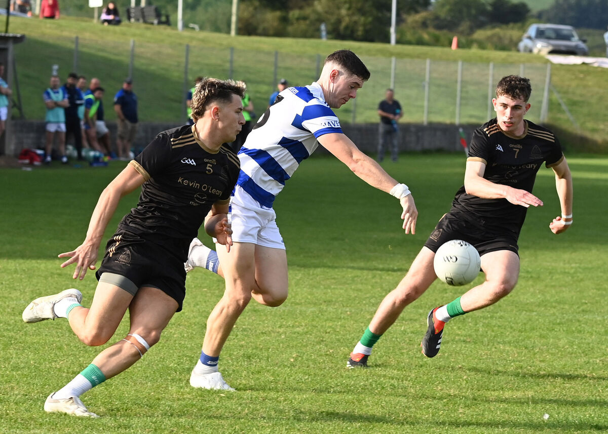 Castlehaven's Rory Maguire has Valley Rovers' Adam Walsh-Murphy and Eoin Guinane for company. Picture: Martin Walsh Castlehaven's Rory Maguire has Valley Rovers' Adam Walsh-Murphy and Eoin Guinane for company. Picture: Martin Walsh