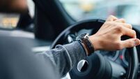 An Unrecognizable Businessman Driving His Car