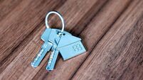 Close-up of house keys on a wooden table