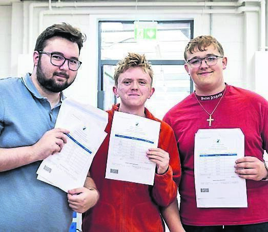 Zsolt Szatmari, Isaac Daly, and Cezary Zimowski with their Leaving Cert results at Coláiste Chríost Rí, Turners Cross. Picture: Chani Anderson
                    