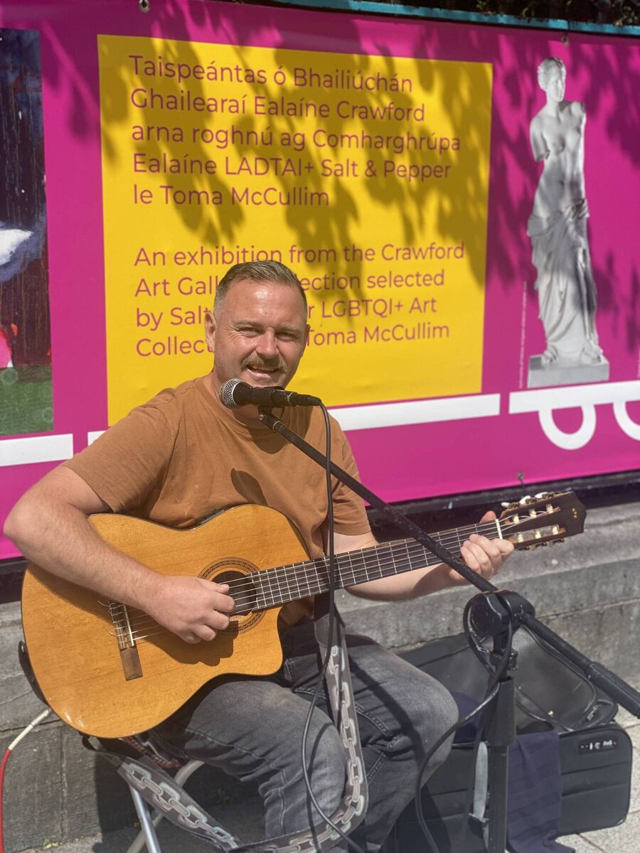 Darren Keane playing outside Crawford Art Gallery