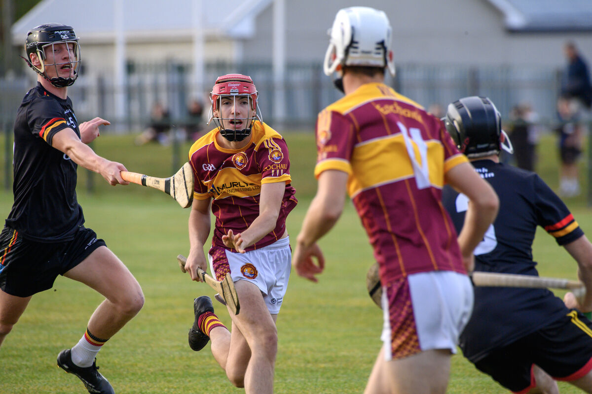  Jamie Lenane, Youghal, gets his pass away under pressure from Darragh Cahill, St Colman's. Picture Dan Linehan