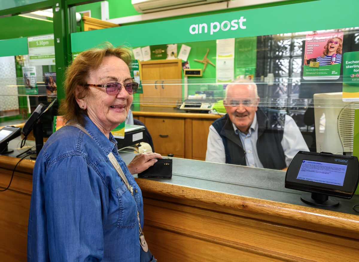 Customer Christine Jennings with Donal Kelleher at the Post Office on Edward Twomey Street, Clonakilty, celebrating its 100th anniversary. Picture Dan Linehan Customer Christine Jennings with Donal Kelleher at the Post Office on Edward Twomey Street, Clonakilty, celebrating its 100th anniversary. Picture Dan Linehan