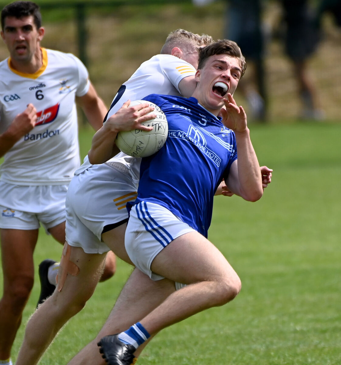 Bantry Blues' Mark Óg O'Sullivan is tackled by Bandon's Conor Calnan last year. Picture: Eddie O'Hare