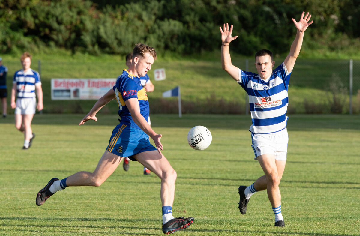 Carrigaline's Ben Corkery-Delaney has a shot on goal despite the attempt to block from Kinsale's Conor Fitzpatrick. Picture: Howard Crowdy Carrigaline's Ben Corkery-Delaney has a shot on goal despite the attempt to block from Kinsale's Conor Fitzpatrick. Picture: Howard Crowdy