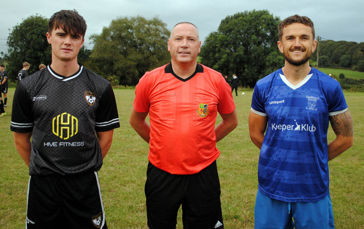 Rathcormac's Richard Morrisson (left), with Corkbeg's Keelan Kennedy, accompanied by referee Alan McDonnagh.
