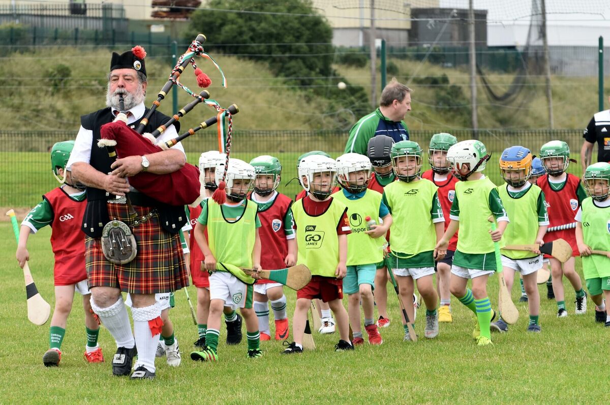 Norman O'Rourke, leading the players, with the under 6s to the front, onto the pitch prior to the St. Vincent's GAA Tony Bulman Memorial Street League finals. Picture: Mike English