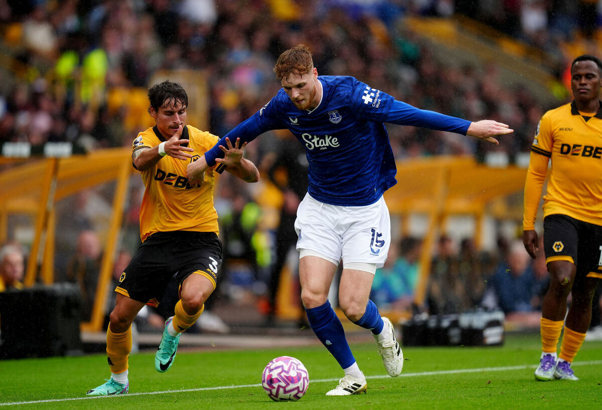 Wolverhampton Wanderers' Hugo Bueno (left) and Everton's Jake O'Brien battle for the ball during the Premier League match at Molineux Stadium, Wolverhampton.
