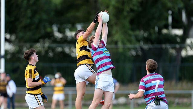 <p> Conrad Murphy of Ibane Gaels and Na Piarsaigh's Jack Cahalane battle for aerial possession in Wednesday's Rebel Óg Premier 2 MFC quarter-final at the Mardyke. Picture: Jim Coughlan</p>