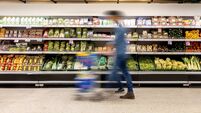 Man shopping at the supermarket - blurred motion
