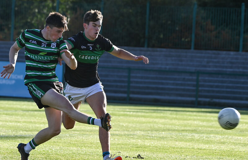 Douglas' Mark O'Brien hammers the ball home despite the efforts of James Randles. Picture: David Keane.  Douglas' Mark O'Brien hammers the ball home despite the efforts of James Randles. Picture: David Keane.