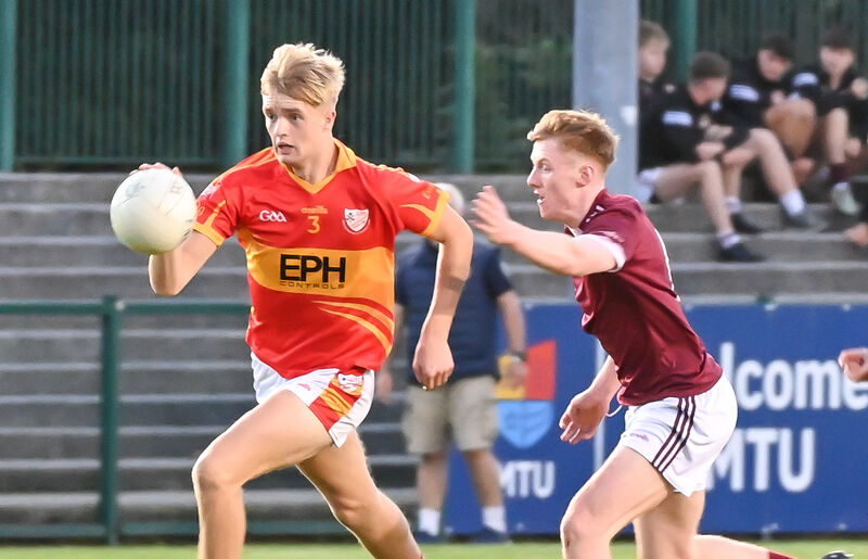 Éire Óg's Eoghan Hogan goes past Bishopstown's Jack Tompkins. Picture: David Keane Éire Óg's Eoghan Hogan goes past Bishopstown's Jack Tompkins. Picture: David Keane