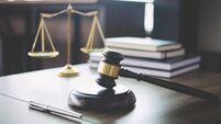 Scales of justice and Gavel on wooden table and Lawyer or Judge working with agreement in Courtroom, Justice and Law concept