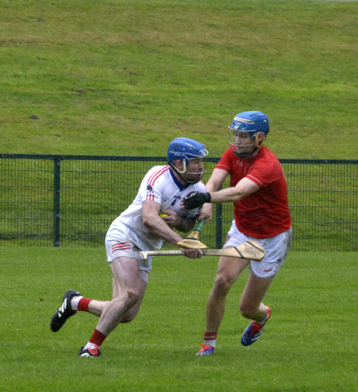 Courcey Rovers' Colm Daly being tackled by Blarney's Shane Mulcahy. Picture: Denis Boyle