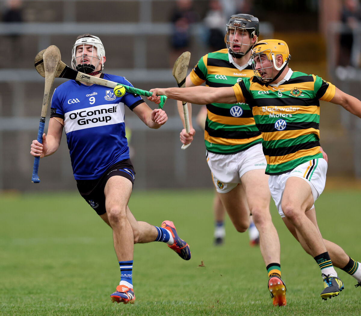 Killian Murphy of Sarsfields tires to get away from Glen Rovers pair Robert Downey and Micheál Mullins. Picture: Jim Coughlan
