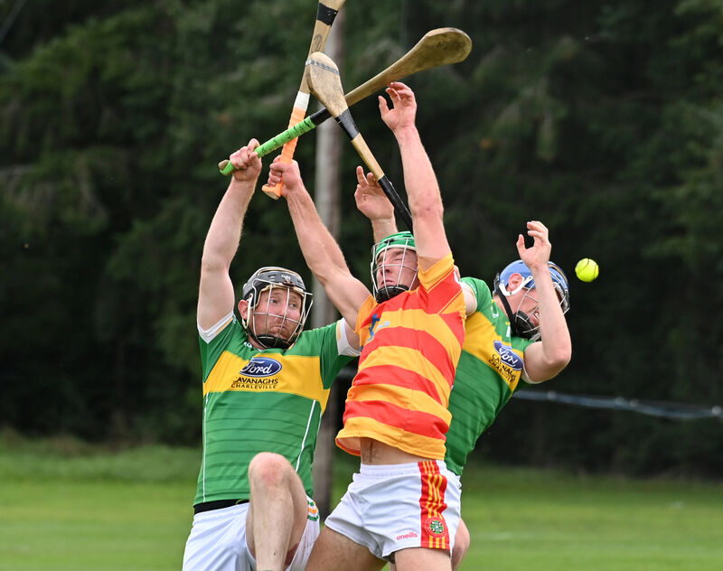 Colm O'Donovan, Newcestown, going high with Newtownshandrum players David O'Connor and Jamie Coughlan. Picture: Dan Linehan Colm O'Donovan, Newcestown, going high with Newtownshandrum players David O'Connor and Jamie Coughlan. Picture: Dan Linehan